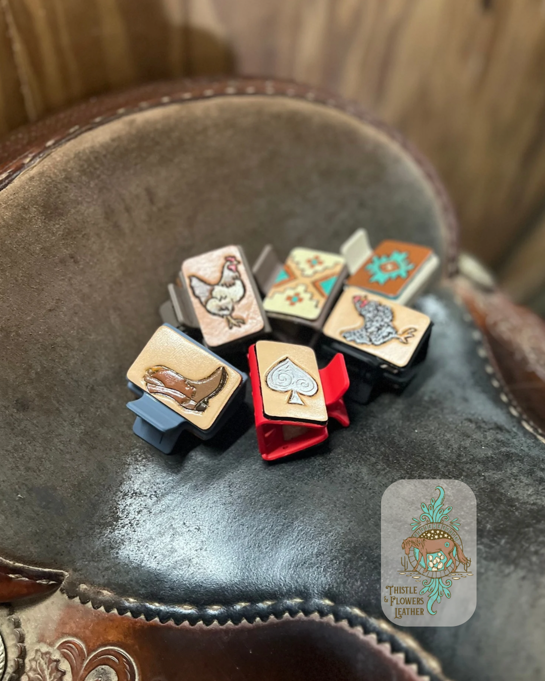 Grouping of medium sized hair clips form the homestead collection on a saddle seat. Photo is taken at an angle. Logo is on the bottom right of photo.