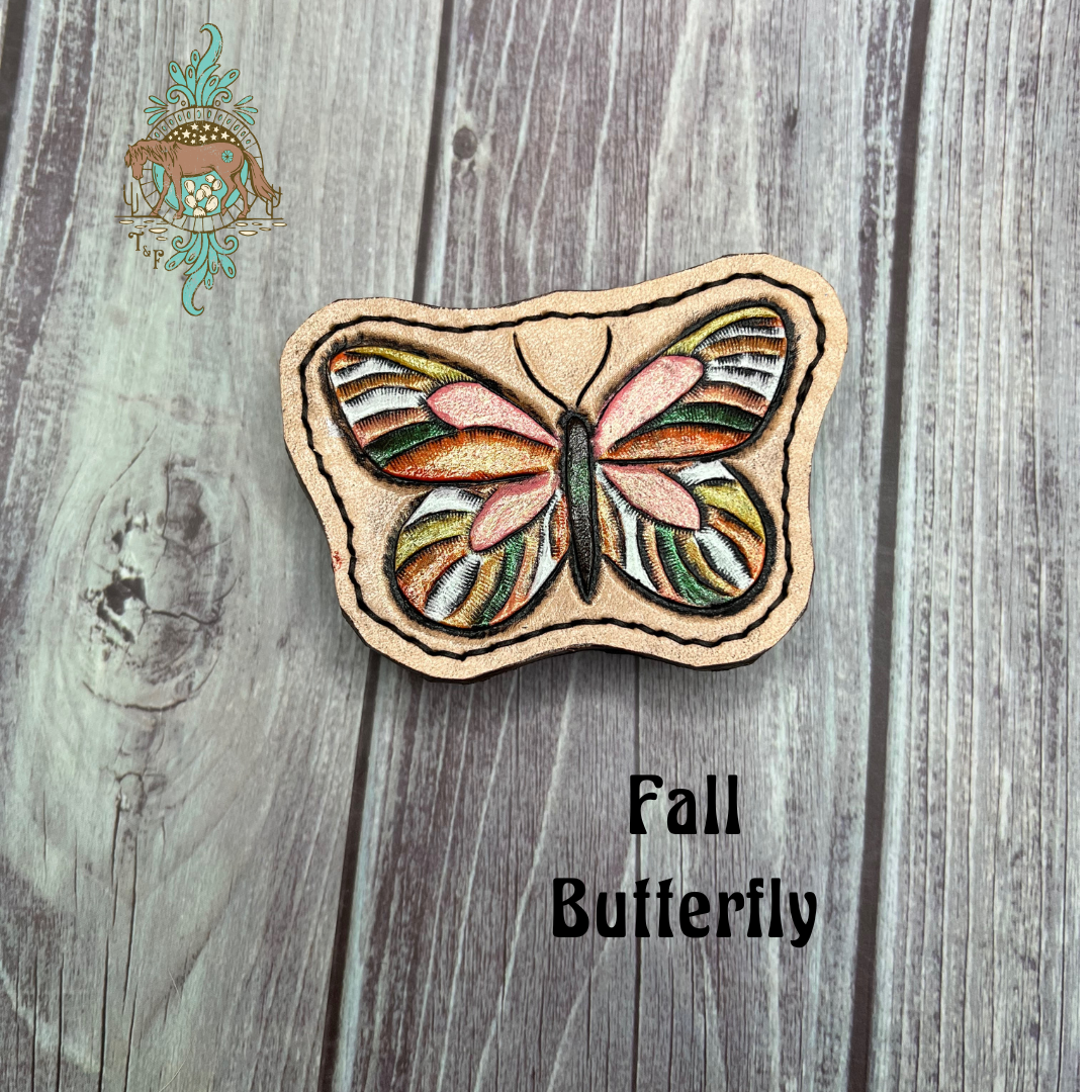 Pink and orange butterfly leather all weather bag charm. Butterfly has an opal finish that gives it an iridescent shine.