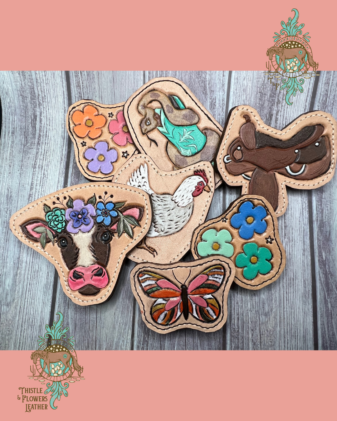 7 all weather bag charms are on a wooden background. The charms are: 1. a cow with a flower crown 2. pink, purple, orange flowers 3. a snake wrapped around a mint boot. 4. a brown western saddle 5. a white and grey chicken 6. blue, green, and teal flowers 7. a pink and orange butterfly